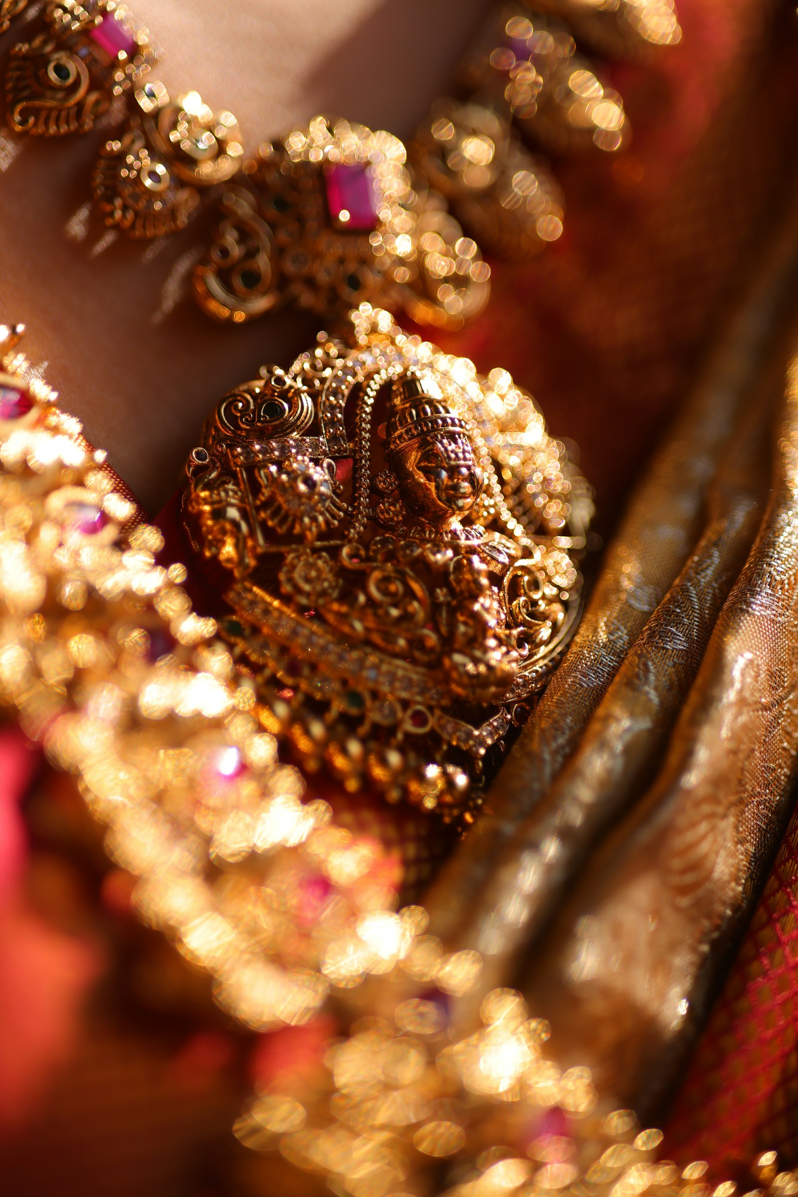 Close-up of layered gold-polish jewellery